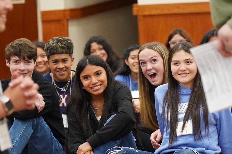 highschool students enjoy their time listening to a speaker at the Sanctus retreat