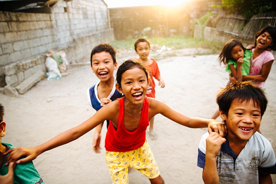 Children from the Philippines play in their neighborhood.