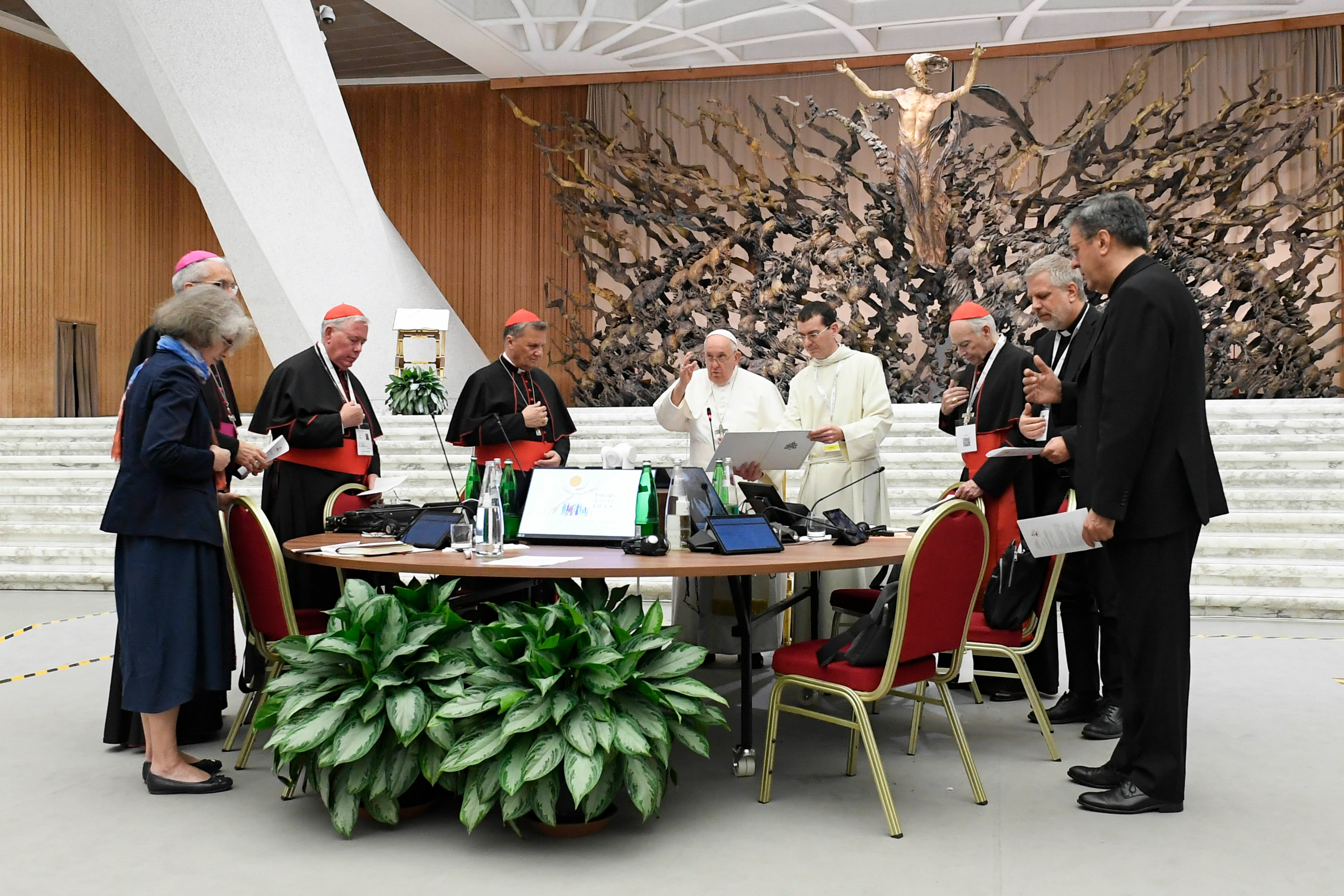 the Pope in a large conference room