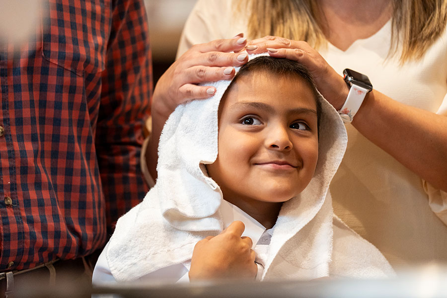 boy with white towel on head