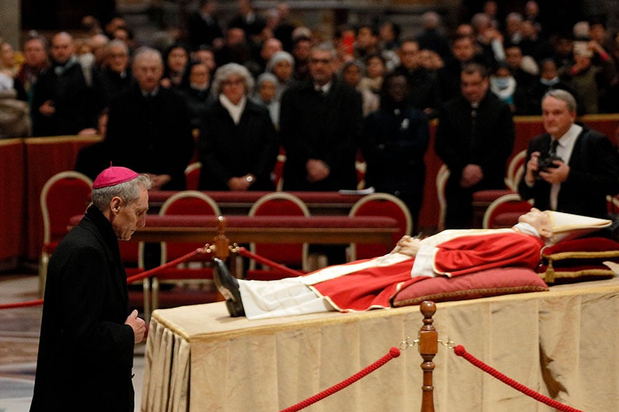 Secretary Ganswein prays at pope's body