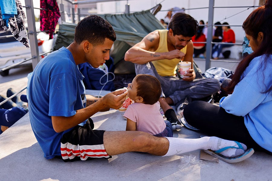immigrant feeds baby girl