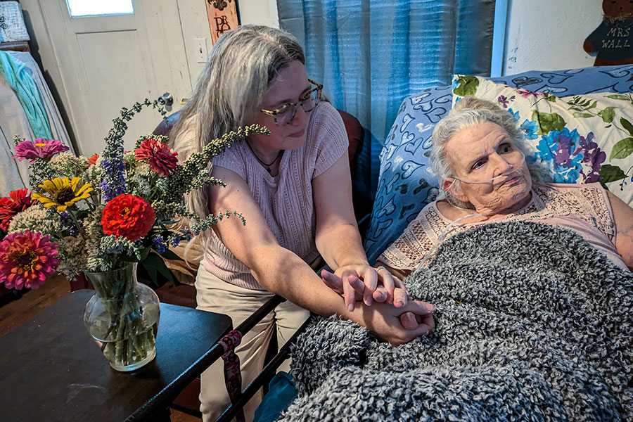 Annice Barber at bedside of sick woman
