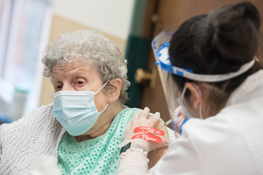 elderly women receiving vaccine