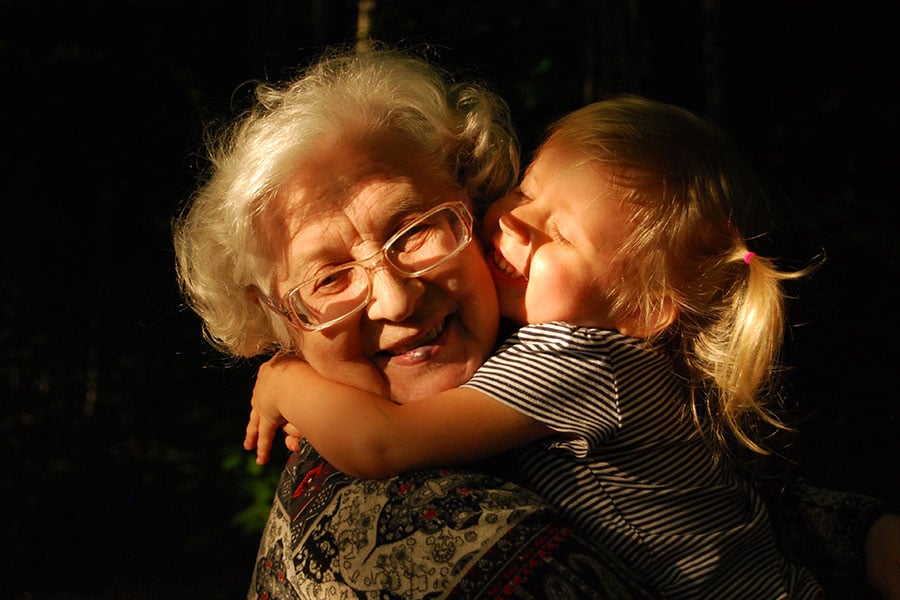 grandmother hugging grandchild