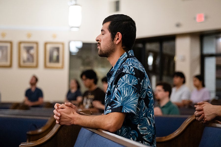young man at prayer