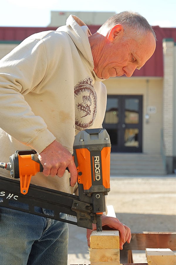 Man drills wood