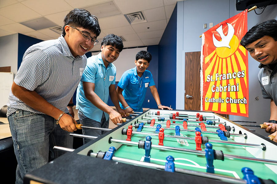 boys playing foosball
