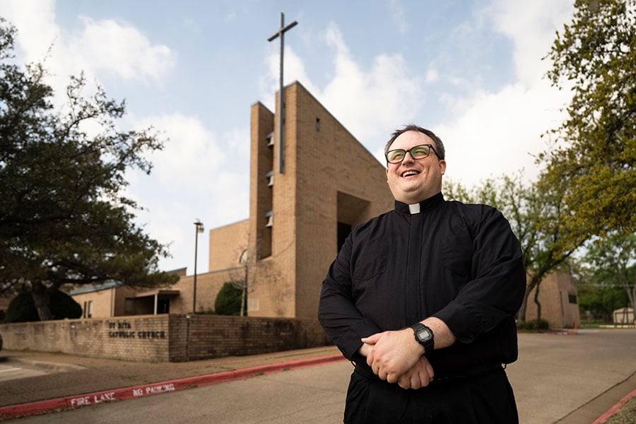 Father Hathaway in front of St. Rita Parish