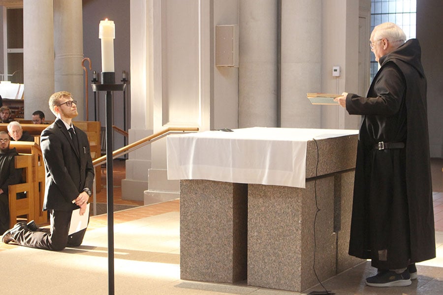 Joseph Hoffschwelle kneels before altar
