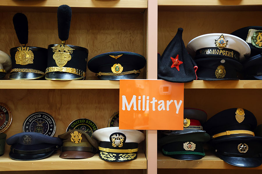 shelf with military hats