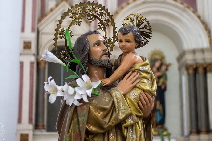 statue of Joseph holding baby Jesus