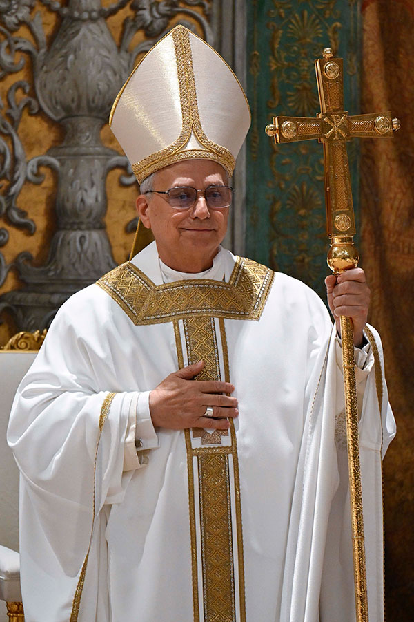 Pope Leo XIV stands with cross