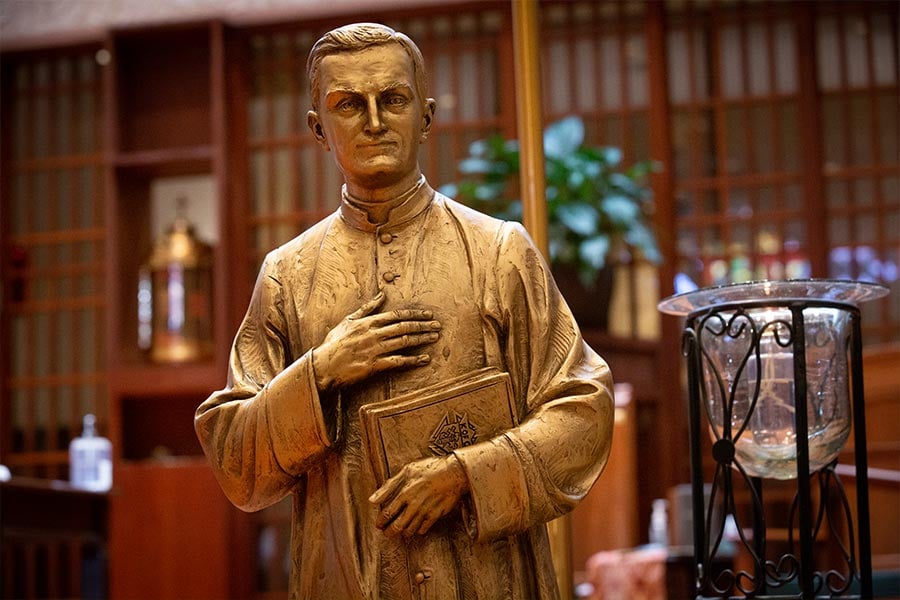 A statue of Father Michael McGivney, the founder of the Knights of Columbus, stands before the altar at Saint Andrew Catholic Church as knights from across the diocese gather to celebrate the beatification of their founder, Saturday, October 31, 2020. (NTC/Rodger Mallison)