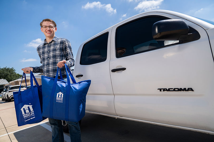 Man with bags at truck