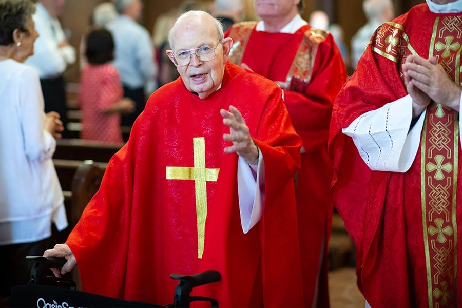 Msgr. Raymund Mullan leads the recession after a Mass to mark the 60th anniversary of his ordination at St. Jude Catholic Parish in Mansfield on Wednesday, June 29, 2022. (NTC/Kevin Bartram)