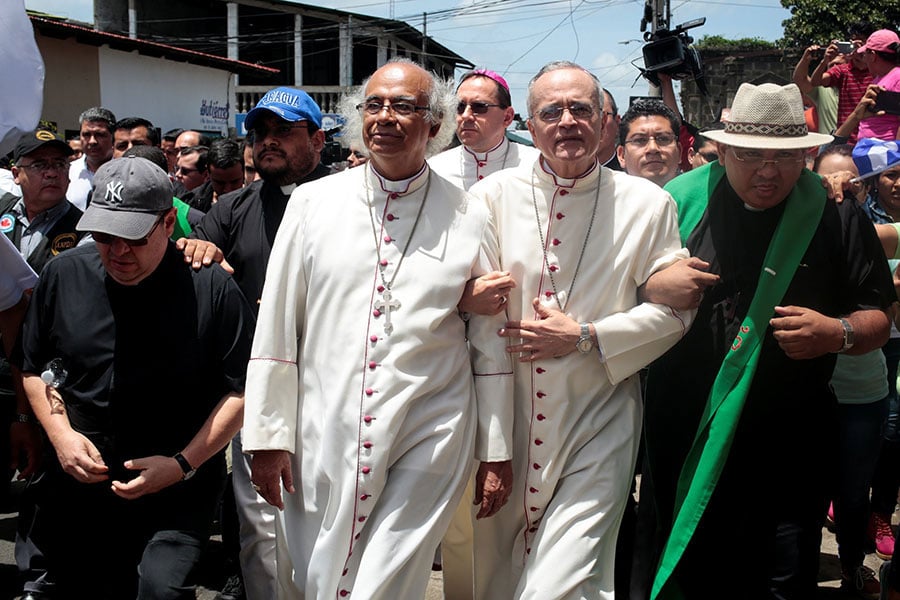 Bishop Silvio José Báez (right) marches with Cardinal Leopoldo Brenes (left) during protests