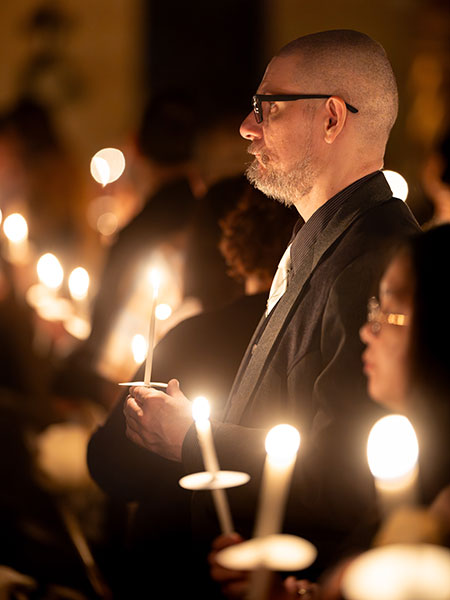 faithful holding candles