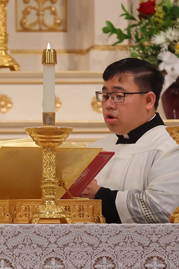 Paul Trinh at altar
