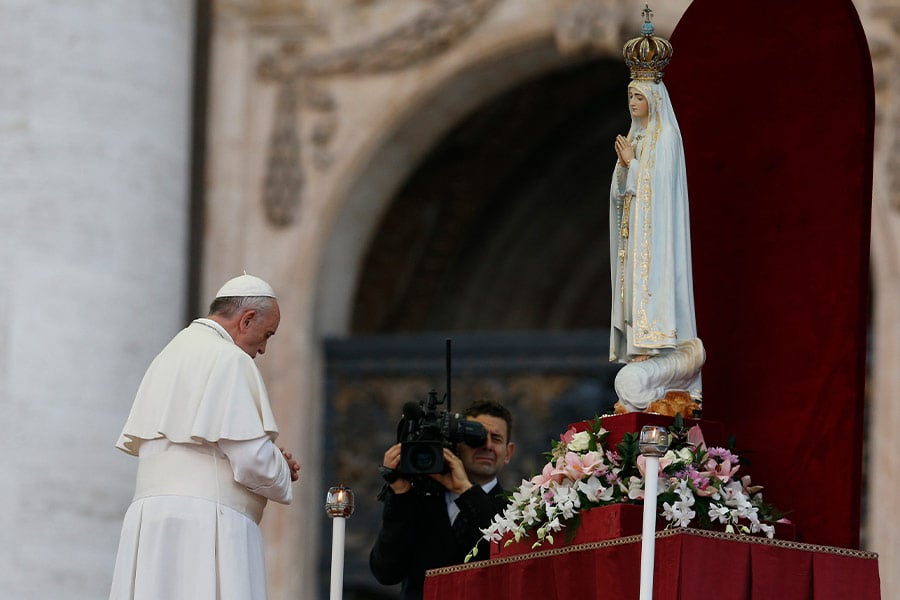 Pope Francis prays in front of the original statue of Our Lady of Fatima during a Marian vigil in St. Peter's Square at the Vatican in this Oct. 12, 2013, file photo. The pope has invited the bishops of the world to join him in "consecrating and entrusting" Russia and Ukraine to Mary March 25, and Bishop Michael Olson will lead a consecration in the Diocese of Fort Worth at 12:05 p.m. on March 25 at St. Patrick Cathedral.