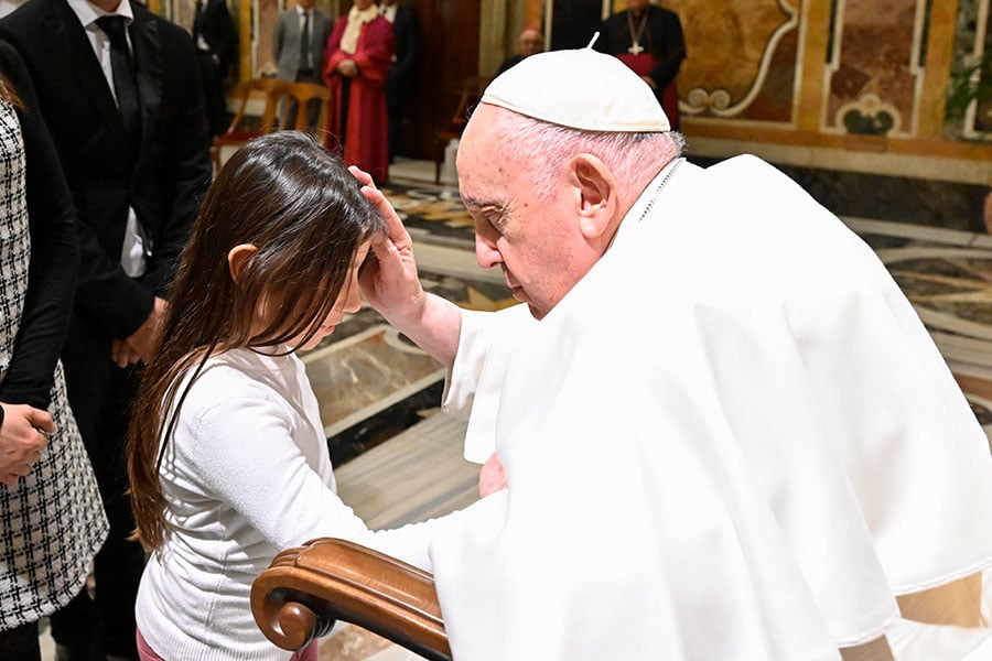 Pope blesses girl