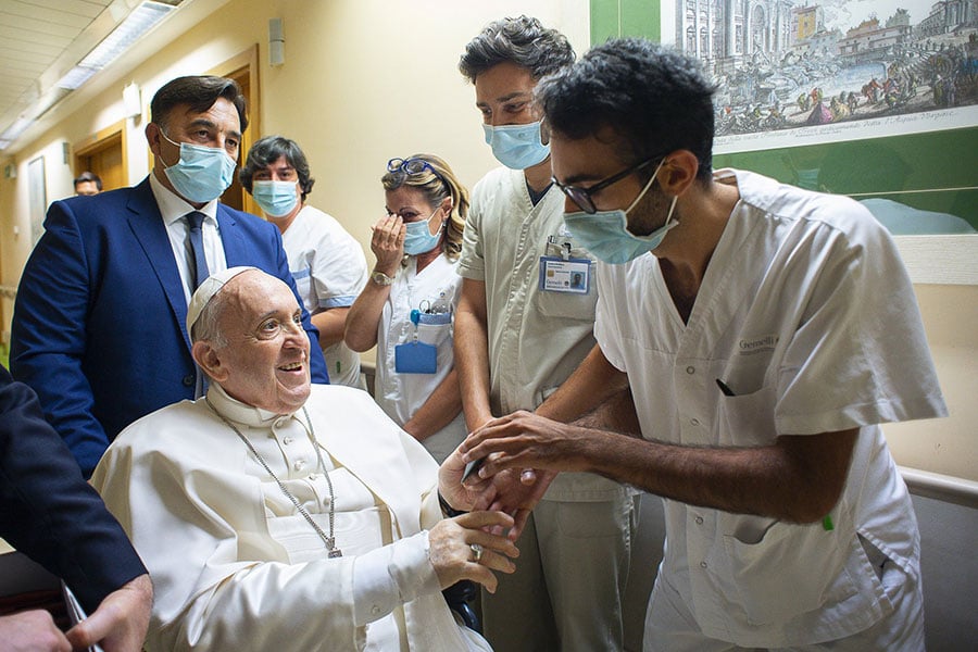 Pope Francis greets hospital staff