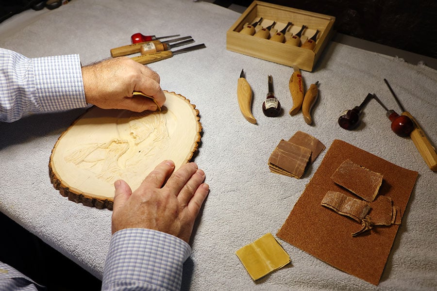 close up of hands creating art