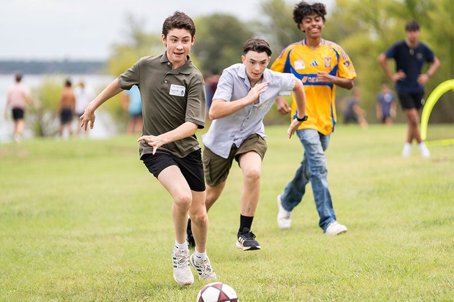 young men playing soccer