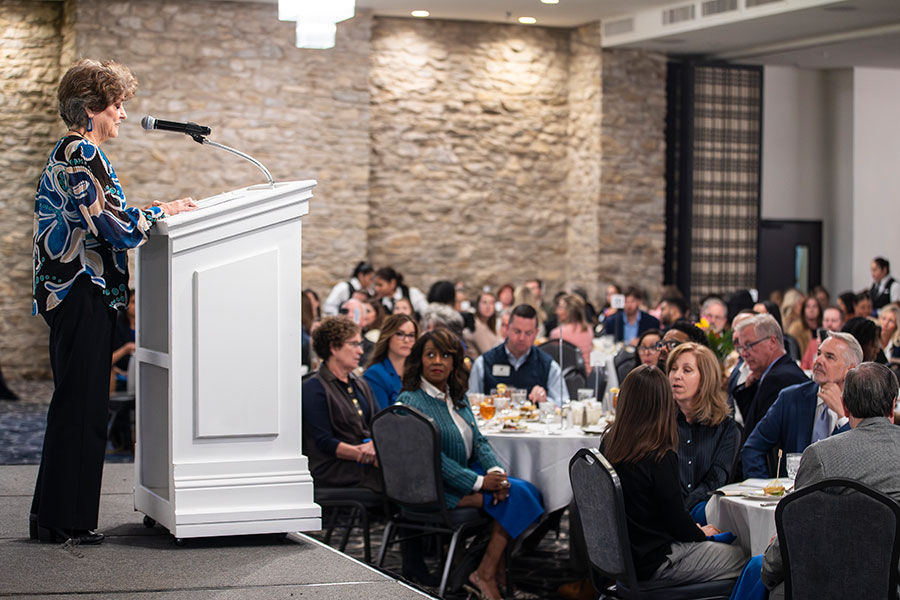 Renee Underwood at podium addresses a crowd