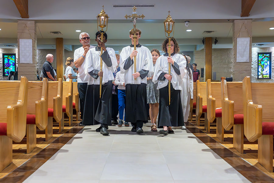 altar servers with crucifix