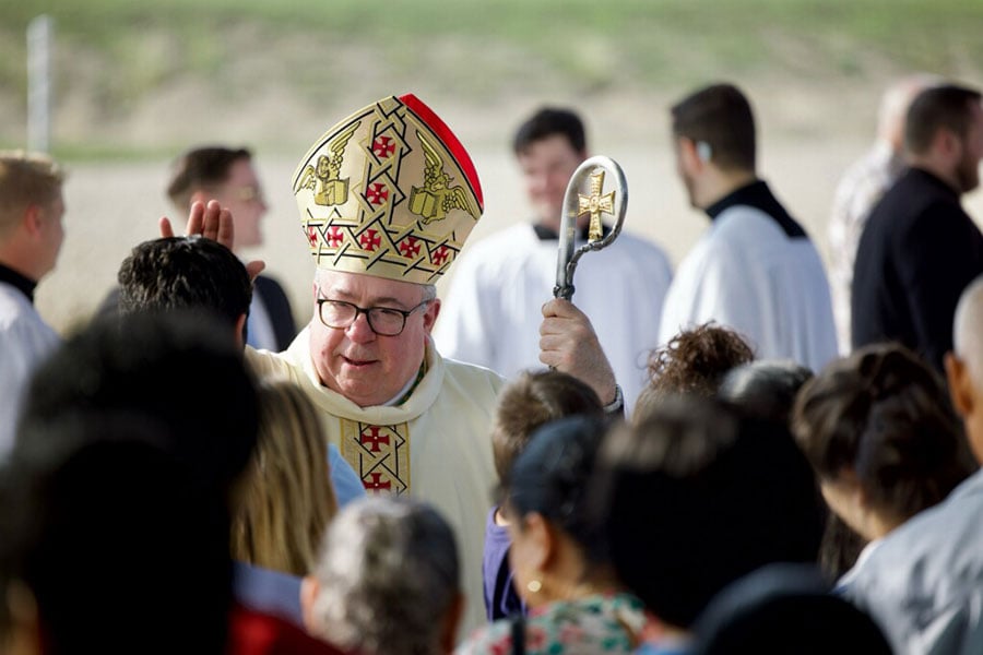 Bishop Olson greets people
