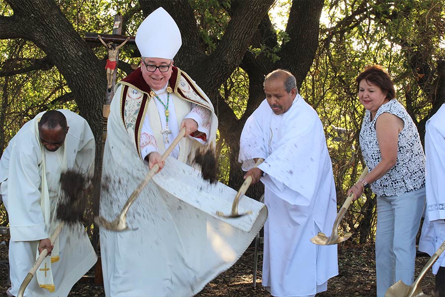 Parochial Vicar Fr. James Amasi, SAC, Bishop Michael Olson, Deacon Tommy Diaz, and DRE Martina Sierra break ground on the new church at Sacred Heart Parish in Comanche. (NTC/Susan Moses)