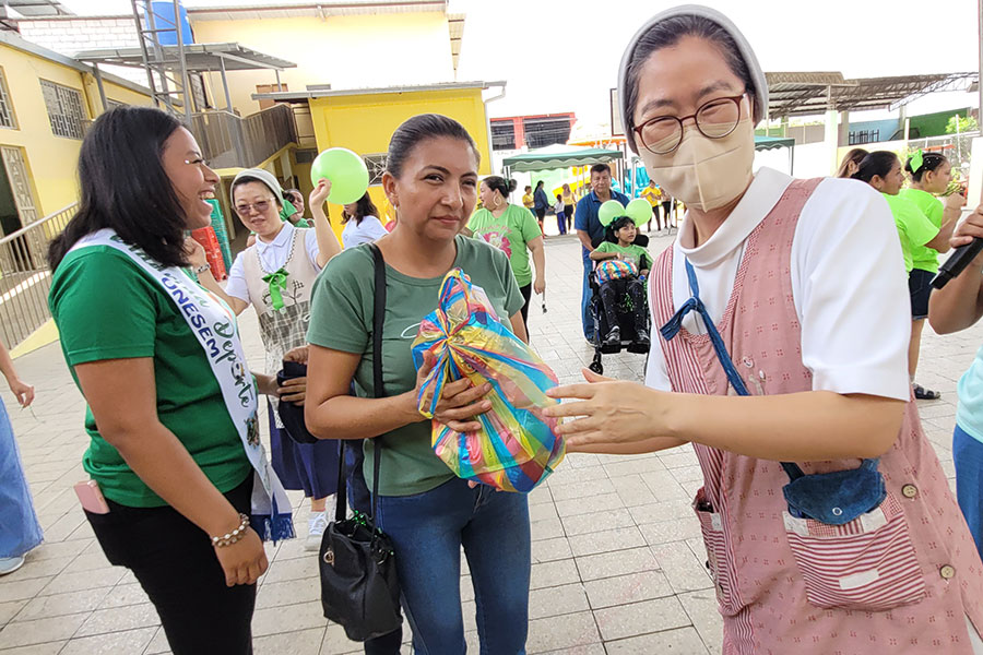 Sister gives gift to woman