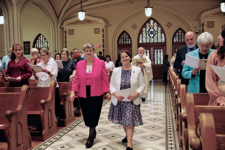 Sister Megan Grewing processes in to Church
