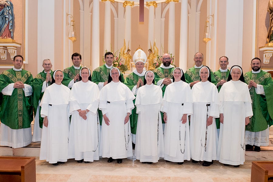 sisters and clergy at altar