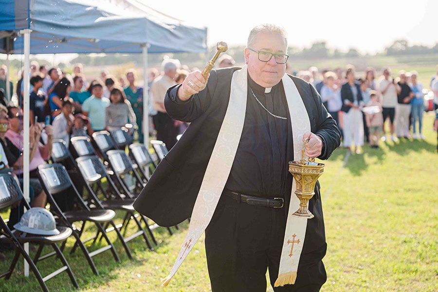 Bishop Olson with aspergillum