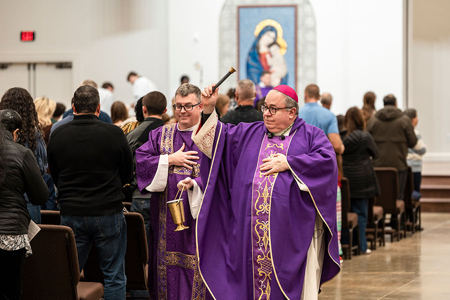 Bishop Olson with holy water