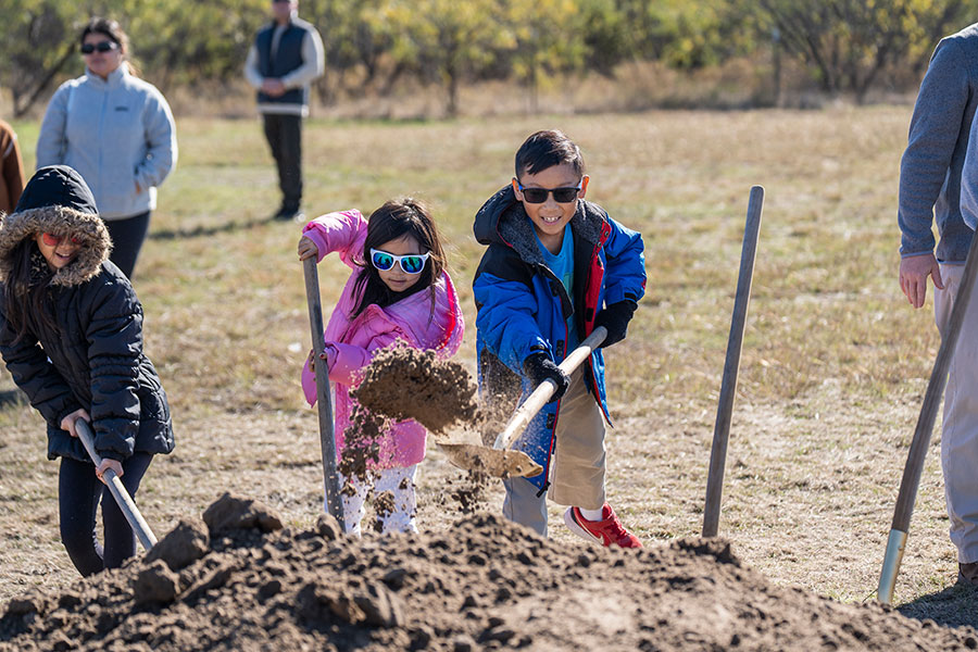 kids shoveling dirt