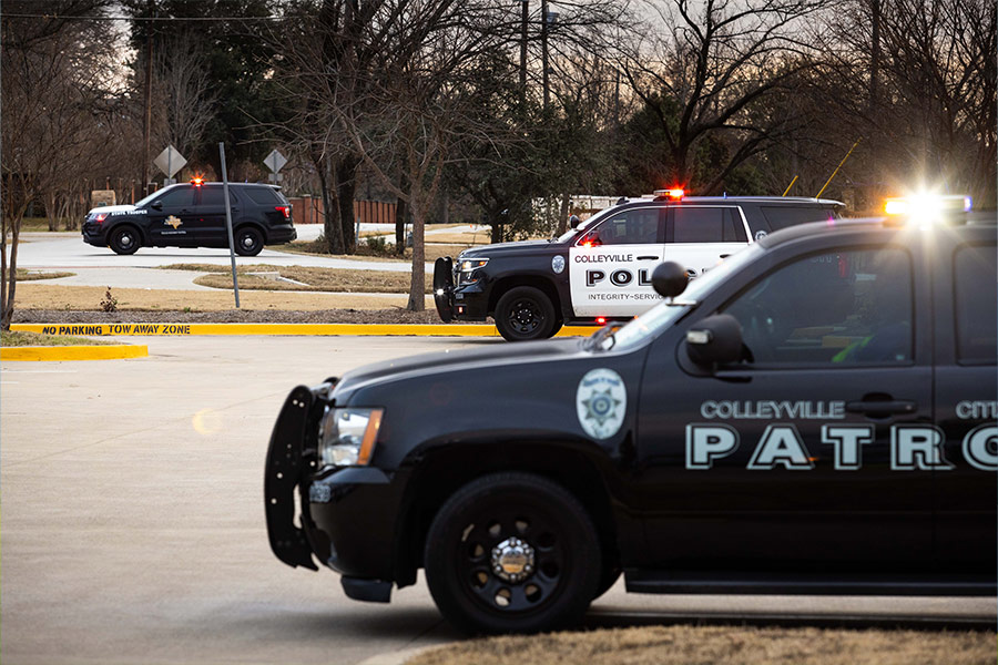 Police crowd the parking lot at Good Shepherd Catholic Church in Colleyville on Saturday, Jan. 15, 2022 after hostages were taken during services at nearby Beth Israel Synagogue.