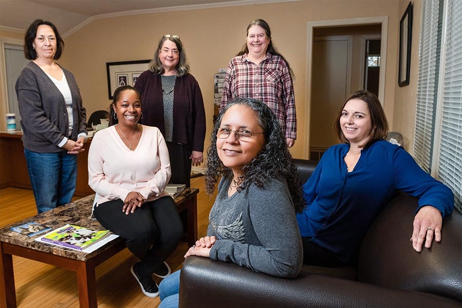 From left, back row: Volunteers Pat Rodriguez, Christy Szempruch, and Marilyn Wachter. Front row: Client Navigator Lythia Green, CCFW Arlington Campus Coordinator Olga Nowlan, and CCFW Volunteer Specialist Kelly Smith, at the CCFW Arlington Campus.