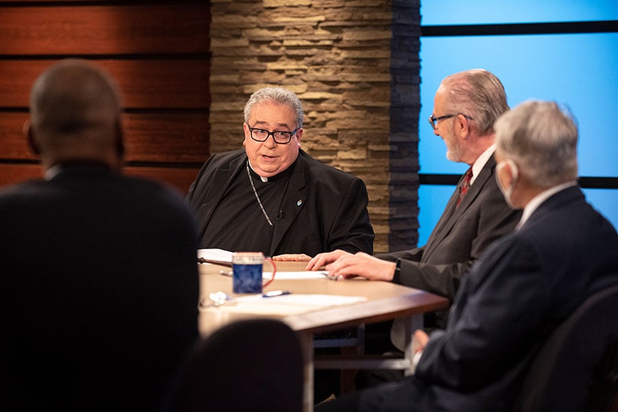 Bishop Michael Olson speaks with Pastor James Winegardner during a taping of the American Religious Town Hall Meeting telecast.