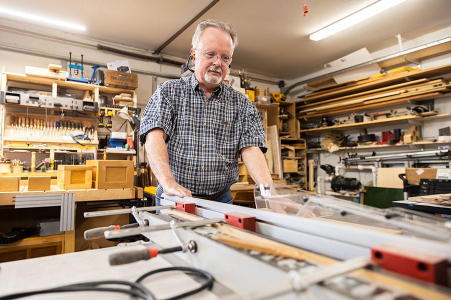 man using table saw
