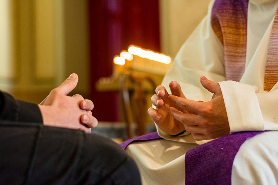 knees and hands in confession