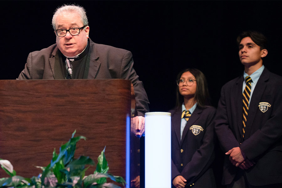 Bishop Michael Olson gives the invocation during the Cristo Rey Fort Worth College Prep commencement ceremony, on Saturday, June 04, 2022 at Will Rogers Auditorium in Fort Worth. (NTC/Ben Torres)