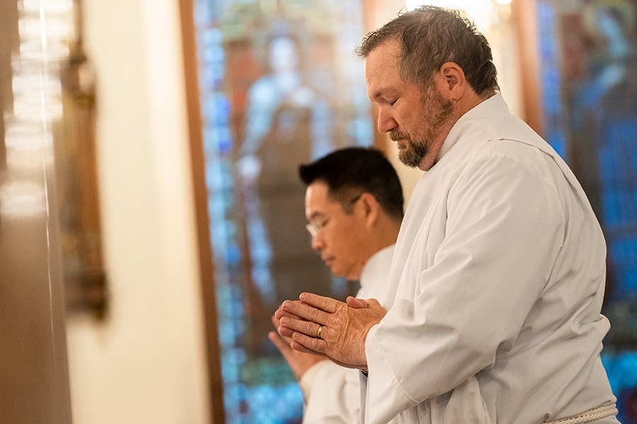two deacons at prayer