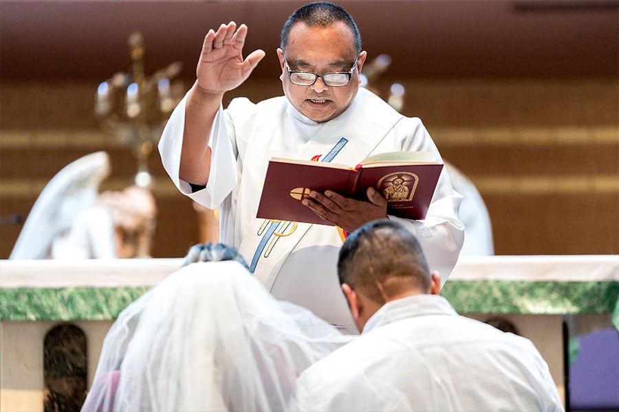 Davy Tolentino, a class of 2022 deacon candidate, rehearses how to conduct the Rite of Marriage during a practicum on Nov. 13, 2021 at St. Peter the Apostle Church in Fort Worth. (NTC/Juan Guajardo)