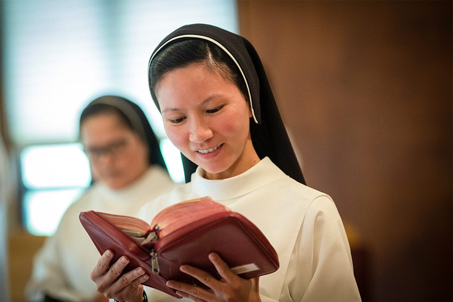 Sr. Mary Vincent Pham, O.P., reads from the Divine Office prayer book during prayer time with the Dominican Sisters at Blessed Imelda Convent on the grounds of Nolan High School, Tuesday, July 21, 2020. (NTC/Rodger Mallison)