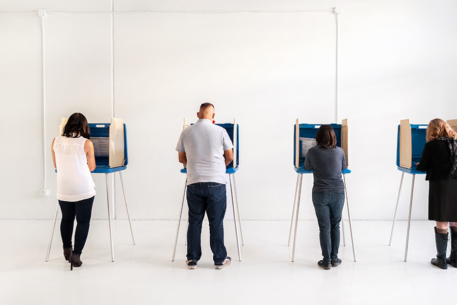 People voting at various voting station.