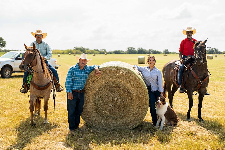 Soto family with hay bale