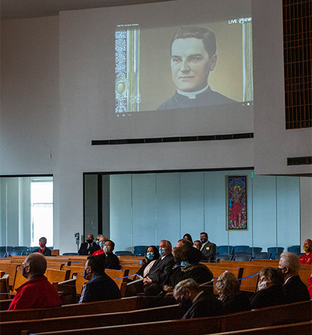 Knights of Columbus from across the diocese watch the beatification Mass.